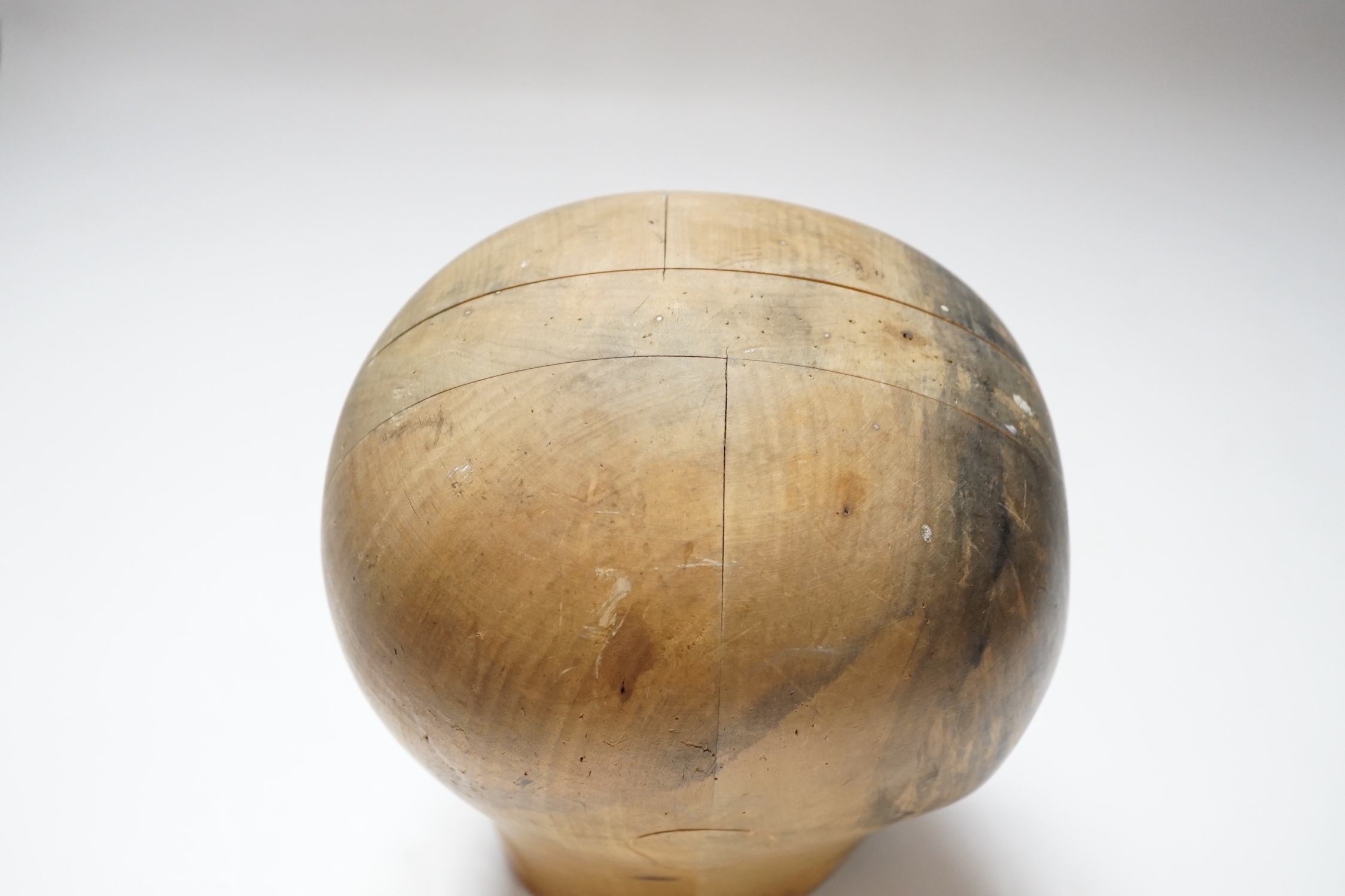 A Hatter's block with hand painted face, stamped Zurich to the base, 25cm high